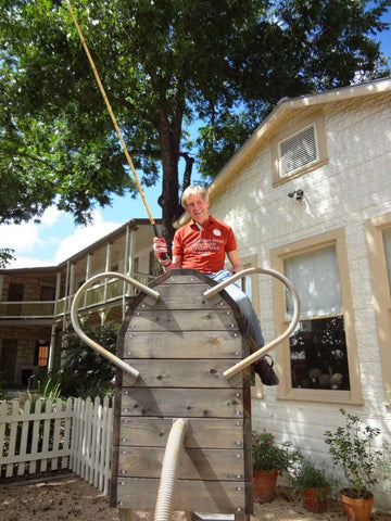Ed Story sits astride his "elephant," practicing elephant polo behind the Elephant Story shop in Comfort, Texas.