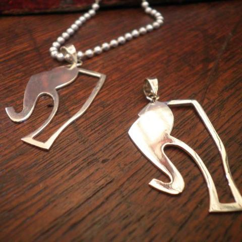 The Elephant Story Logo Charm and Necklace